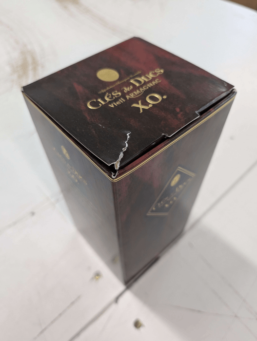 Cles des Ducs XO - poškozený obal